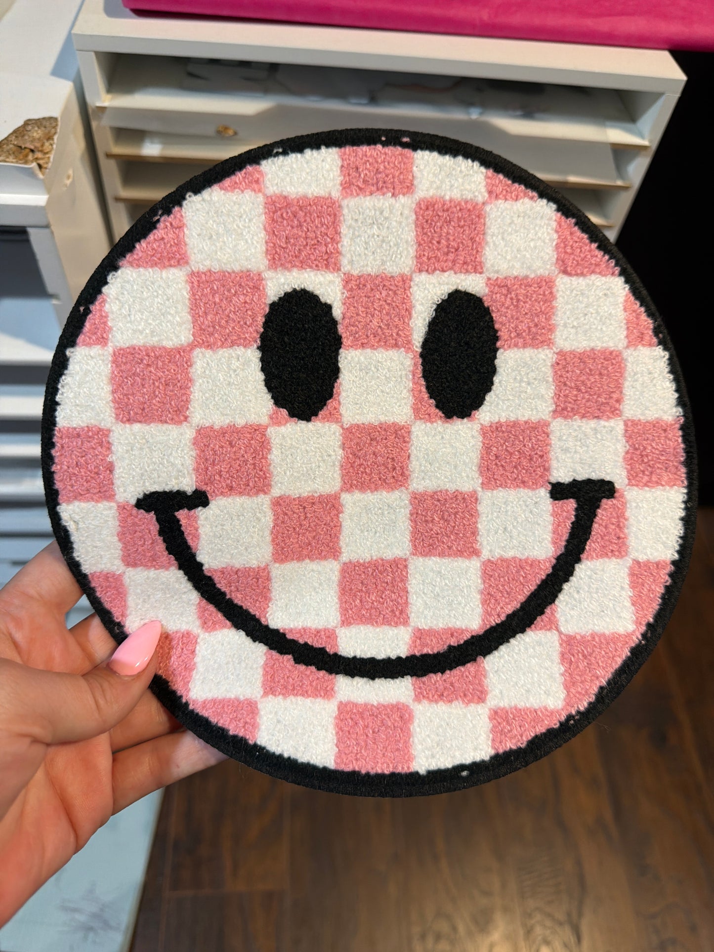 Pink checkard smiley face