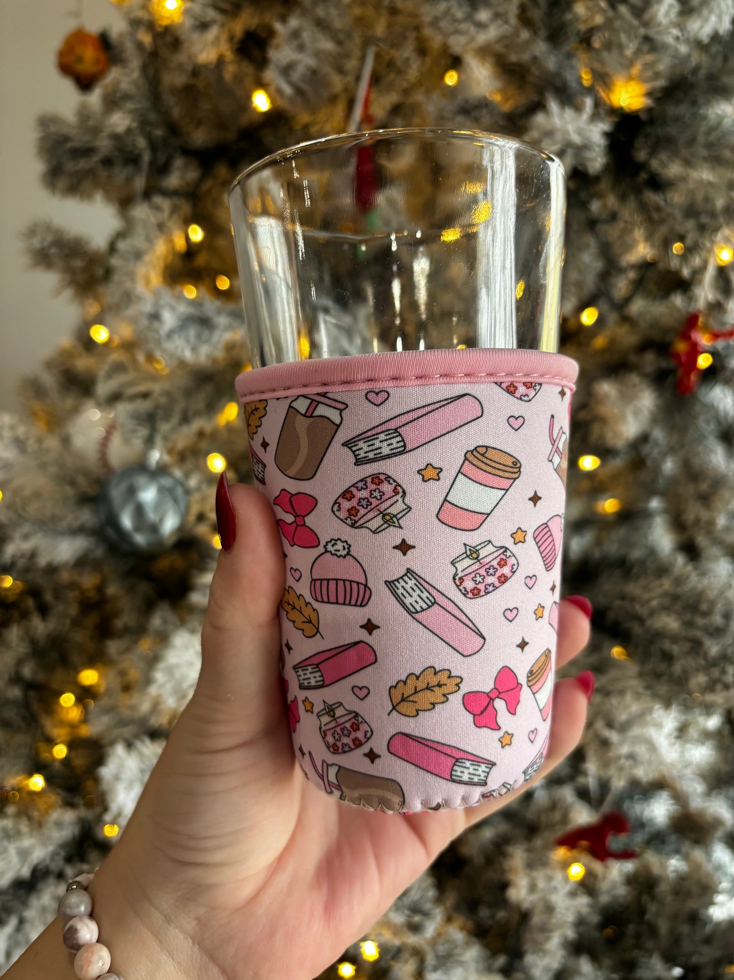 Coffee, books, bows and leaf fall Reusable cup sleeve